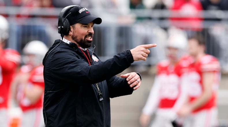 FILE - Ohio State head coach Ryan Day directs his team during an NCAA college spring football game on April 16, 2022, in Columbus, Ohio. Ohio State is hiking Day's annual salary to $9.5 million, as part of a two-year contract extension that will put him among the nation's highest-paid college football coaches.  (AP Photo/Jay LaPrete, File)