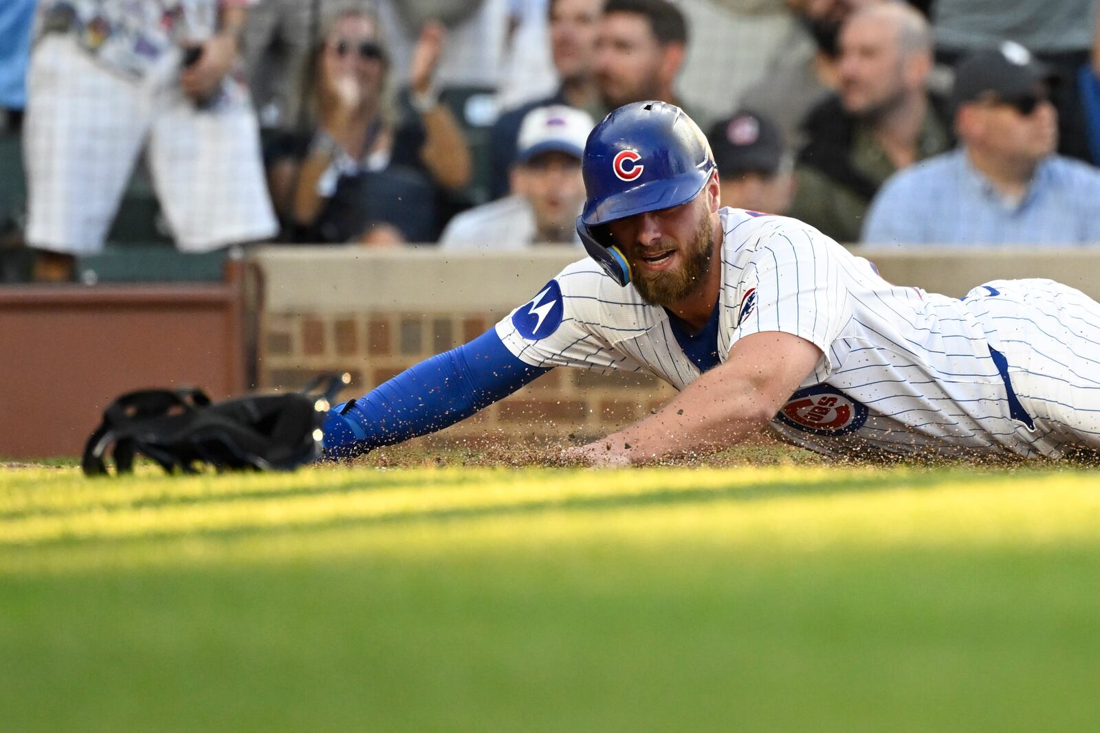Chicago Cubs' Michael Busch scores during the second inning of a baseball game against the Cleveland Guardians, Tuesday, July 1, 2025, in Chicago. (AP Photo/Matt Marton)