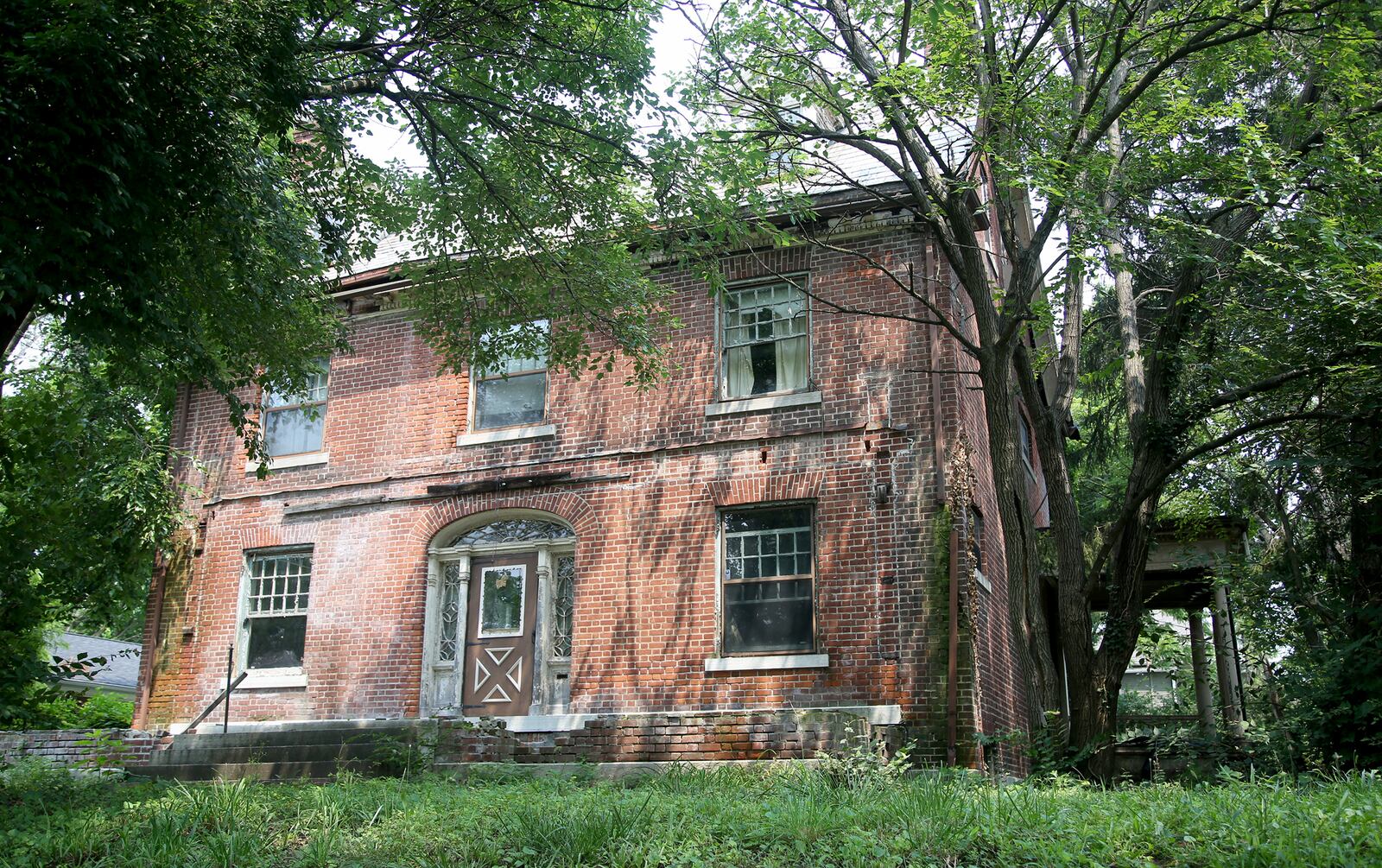 Judge Edward T. Snediker built this brick Georgian-style home in the Dayton View Historic District in 1905. Snediker died on Oct 19, 1939. The property was added to the National Register of Historic Places in 1984. LISA POWELL / STAFF
