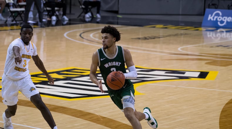 Wright State's Tanner Holden drives past NKU's Marques Warrick during a game last season at NKU. The Norse topped the Raiders on Tuesday night.. Joseph Craven/Wright State Athletics