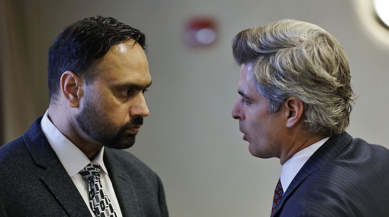 Defense attorney Charles M. Rittgers, right, speaks with his client Gurpreet Singh, charged in a quadruple homicide in West Chester Twp., during a hearing in Butler County Common Pleas Court Wednesday, Nov. 10, 2021 in Hamilton. NICK GRAHAM / FILE PHOTO
