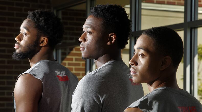 Josh Cunningham, Kendall Pollard and Kyle Davis, (left to right) members of the University of Dayton men’s basketball team, are all from Chicago. LISA POWELL / STAFF