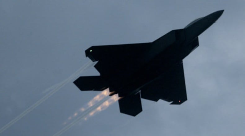 A F-22 Raptor flies through the air at Freedom's Call 2008, the Air Force Materiel Command Tattoo held at Wright-Patterson Air Force Base in Fairborn Friday June 27. FILE