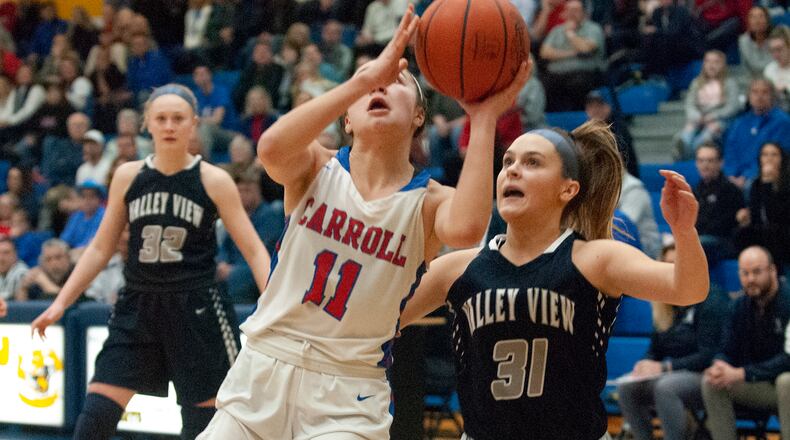 Carroll’s Ava Lickliter drives against Valley View’s Kailee Ramps during the first half of Tuesday night’s Division II regional semifinal at Springfield High School. Jeff Gilbert/CONTRIBUTED