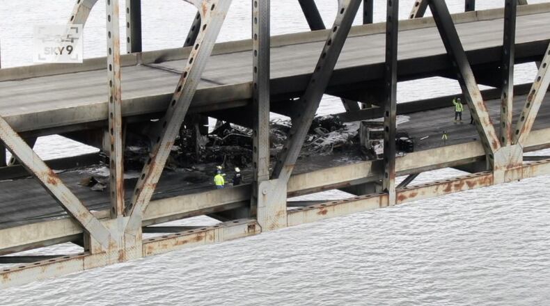Michael Benedic
Crews survey the damage on the lower deck of the Brent Spence Bridge on Wedensday, Nov. 11, 2020. Two semitrailers crashed on the bridge, and the chemical fire that followed damaged the top deck, officials said. CONTRIBUTED BY MICHAEL BENEDIC / WCPO-TV