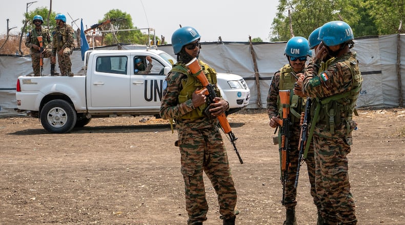 United Nations peacekeepers stand near an airstrip in Akobo, South Sudan, Saturday, Feb. 21, 2026. (AP Photo/Florence Miettaux)