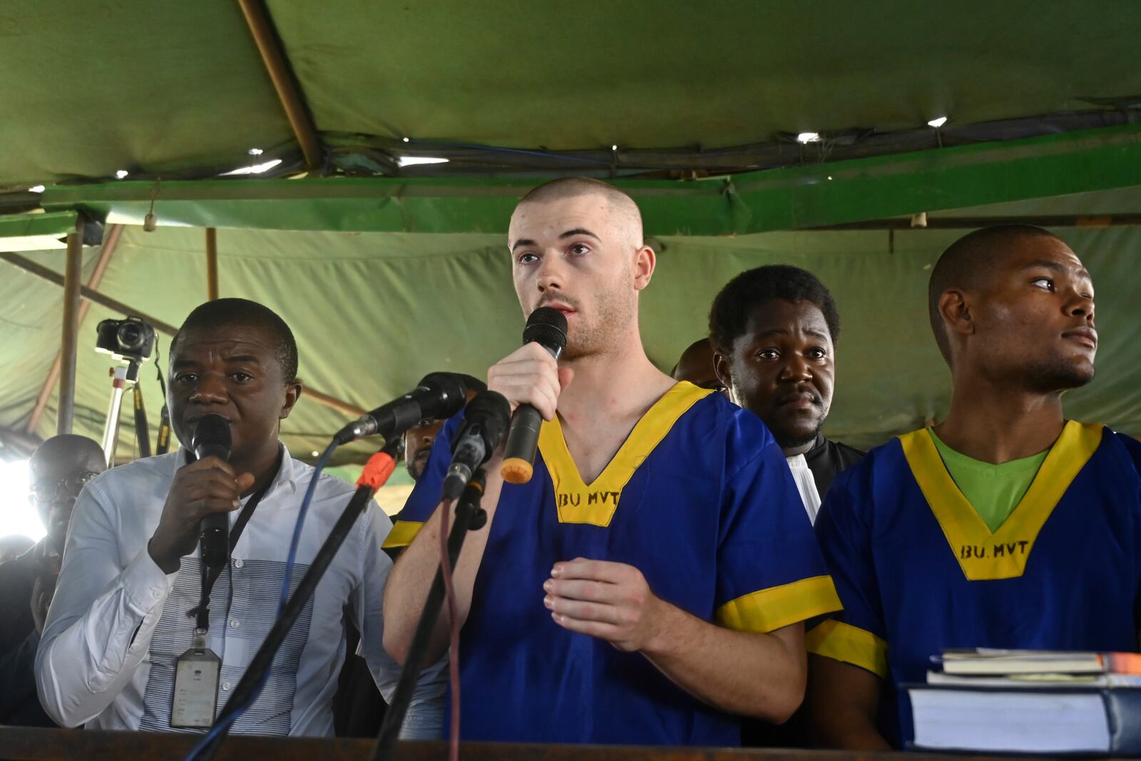 FILE - Tyler Thompson Jr, addresses the court in Kinshasa with 52 other defendants Friday June 7, 2024, accused of a role in last month's attempted coup in Congo, led by little-known opposition figure Christian Malanga, in which six people were killed. (AP Photo/Samy Ntumba Shambuyi, file)