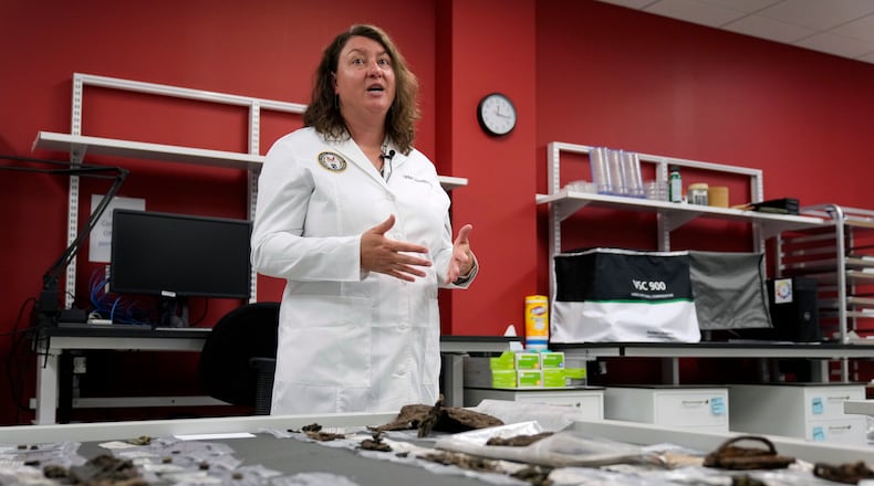 Defense POW/MIA Accounting Agency forensic anthropologist Carrie Brown speaks in a lab at Offutt Air Force Base, Monday, May 20, 2024, in Bellevue, Neb. (AP Photo/Charlie Neibergall)