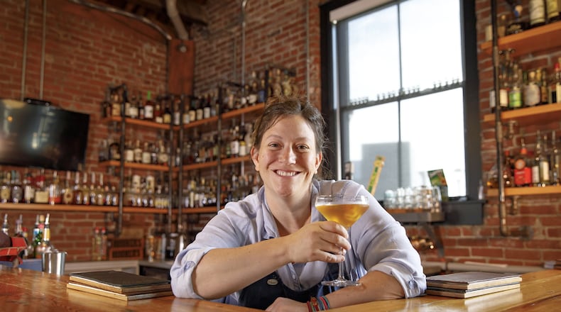 Chef Sara Bradley of the freight house curates a farm-to-table dining experience and bar featuring handcrafted cocktail drinks and a staggering collection of Kentucky bourbon. (the freight house)