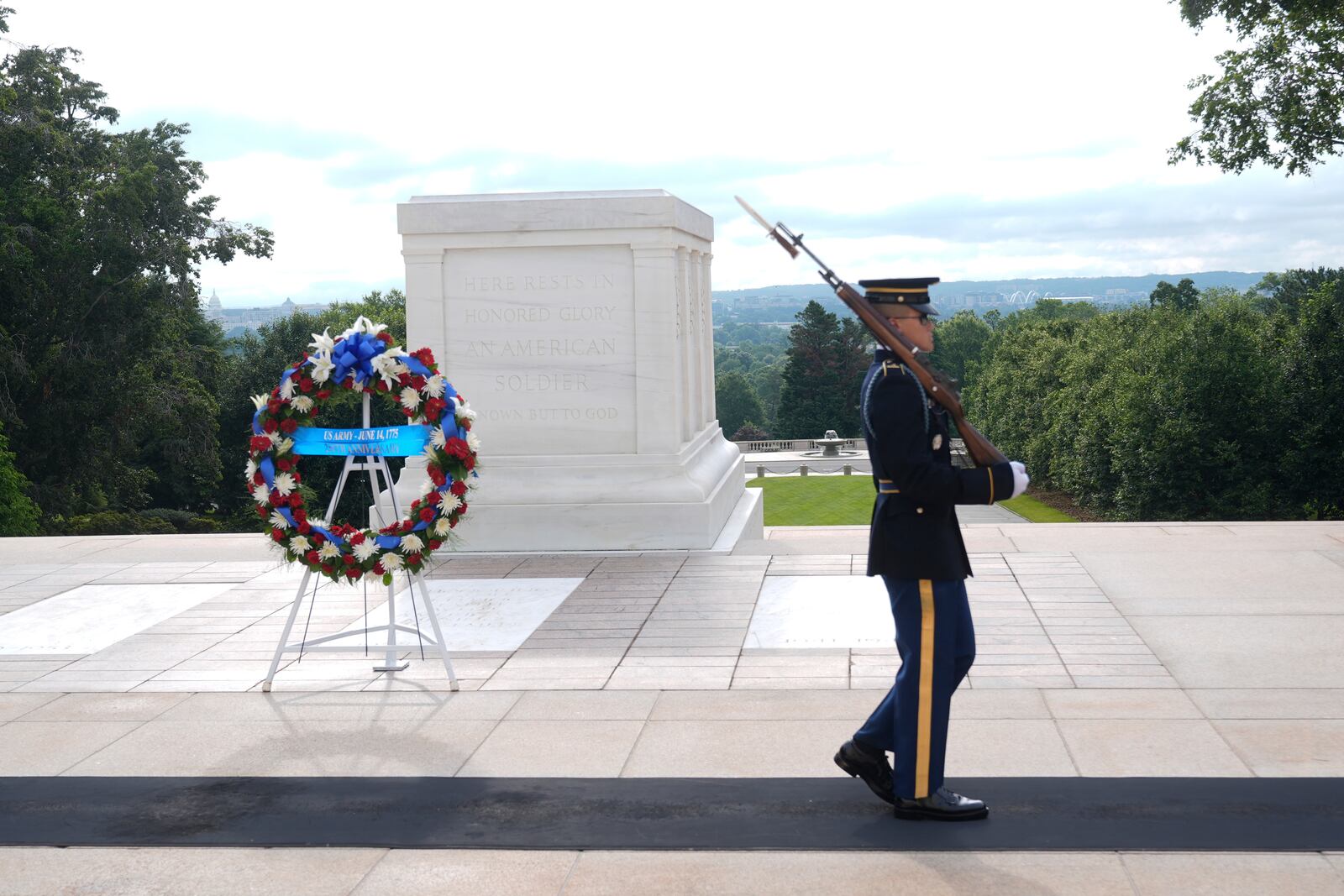 A a Tomb Guard from the U.S. Army's 3rd Infantry Regiment, "The Old Guard" guards the Tomb of the Unknown Soldier at Arlington National Cemetery, after a wreath laying honoring the Army's 250th anniversary and coinciding with President Donald Trump's 79th birthday, Saturday, June 14, 2025, in Arlington, Va. (AP Photo/Manuel Balce Ceneta)