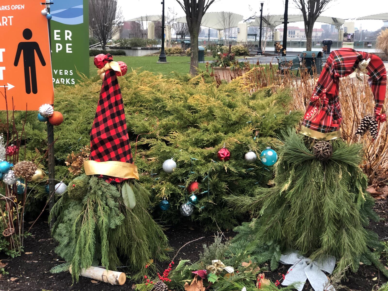 Visitors to the Five Rivers MetroParks were encouraged to hunt for holiday gnomes, like these at RiverScape. CORNELIUS FROLIK / STAFF