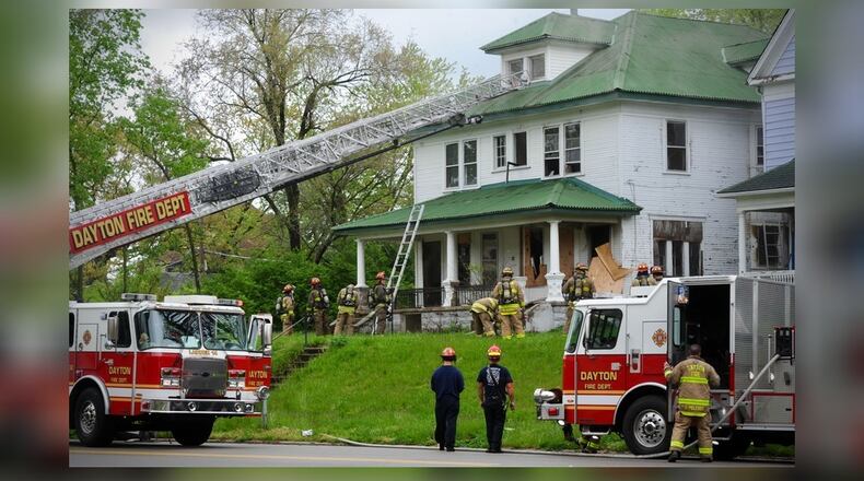 Firefighters were called to a fire at a boarded up house in the 500 block of Forest Avenue in Dayton's Five Oaks neighborhood on Thursday, April 29, 2021. MARSHALL GORBY/STAFF