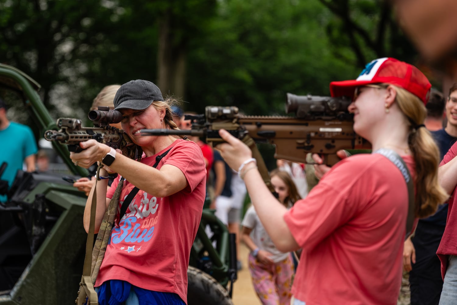 People hold weapons at a ranger tent during the U.S. ArmyÕs 250th anniversary festival on the National Mall in Washington, on Saturday, June 14, 2025. (Eric Lee for The New York Times)