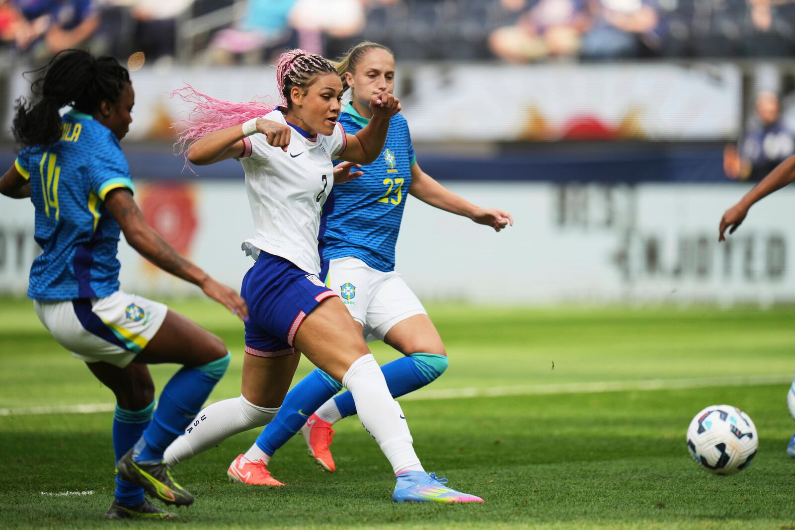 United States forward Trinity Rodman (2) shoots to score as she is defended by Brazil forward Ludmila (14) and defender Isa Haas (23) during the first half of a women's international friendly soccer match in Inglewood, Calif. Saturday, April 5, 2025. (AP Photo/Jae C. Hong)