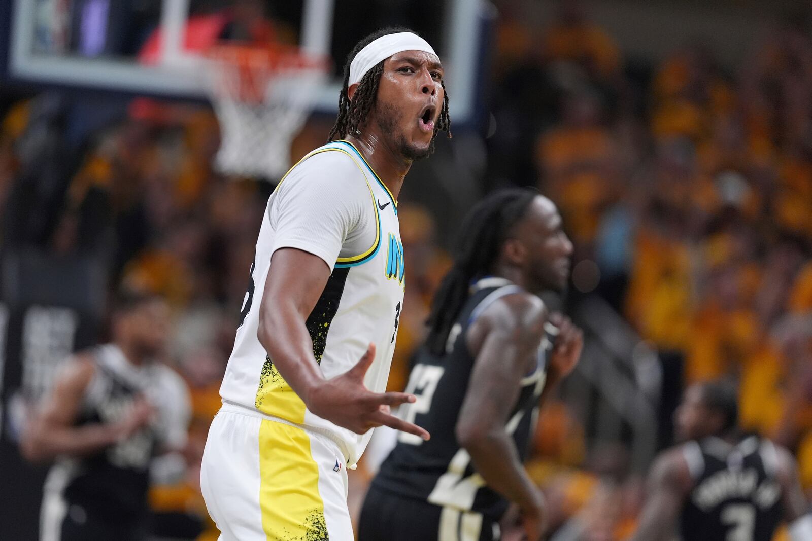 Indiana Pacers' Myles Turner celebrates after making a 3-point basket during the second half of a first-round NBA basketball playoff game against the Milwaukee Bucks, Saturday, April 19, 2025, in Indianapolis. (AP Photo/Michael Conroy)