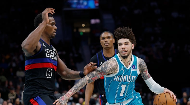 Charlotte Hornets guard LaMelo Ball (1) drives against Detroit Pistons center Jalen Duren (0) during the second half of an NBA basketball game in Charlotte, N.C., Monday, Feb. 9, 2026. (AP Photo/Nell Redmond)