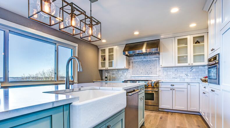 Most people call in professionals to change their cabinets. Cabinet replacement can be a do-it-yourself job, but it involves measuring and ensuring everything fits and is leveled appropriately. Homeowners who choose to reface their cabinets themselves may opt to paint or restain. Wood veneer or a new-door and drawer-panel installation can be complicated and is best left to qualified contractors. CONTRIBUTED