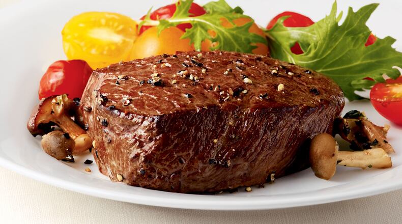 Succulent Filet in a Field of Greens. CATTLEMEN;S BEEF BOARD