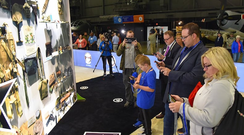 Visitors to the National Museum of the U.S. Air Force experience the augmented reality exhibit D-Day: Freedom from Above, which engages visitors with a historically accurate journey back in time to Sainte-Mere-Eglise, the first French town to be liberated on June 6, 1944 during World War II. (U.S. Air Force photo/Ken LaRock)