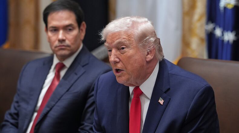 President Donald Trump speaks as Secretary of State Marco Rubio listens during a cabinet meeting at the White House, Thursday, Jan. 29, 2026, in Washington. (AP Photo/Evan Vucci)