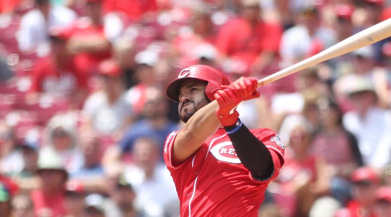 The Reds’ Eugenio Suarez hits a two-run home run in the third inning against the Pirates on Wednesday, July 31, 2019, at Great American Ball Park in Cincinnati. David Jablonski/Staff