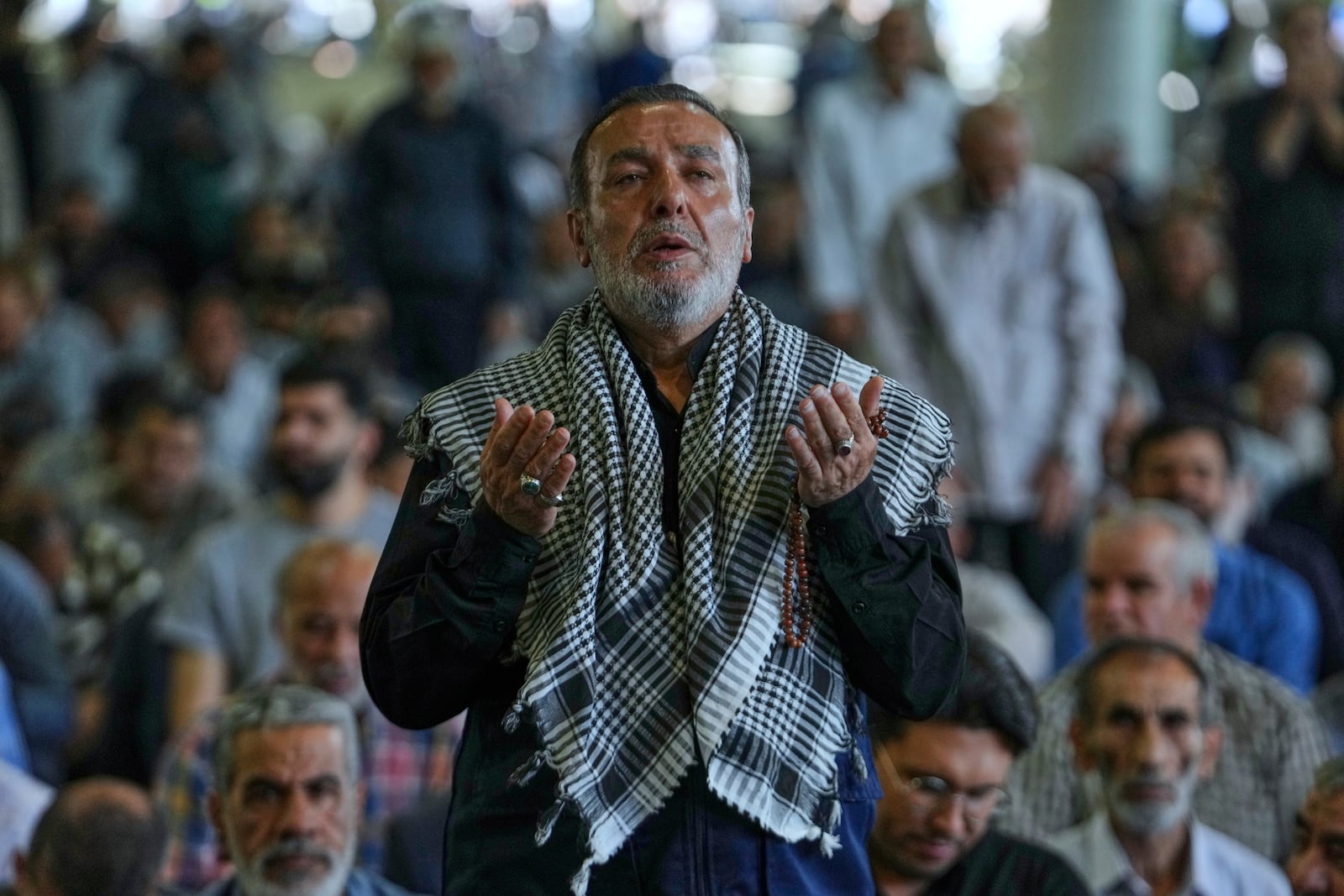 An Iranian worshipper prays as he attends Friday prayers ceremony at Tehran University campus in Tehran, Iran, Friday, June 13, 2025. (AP Photo/Vahid Salemi)