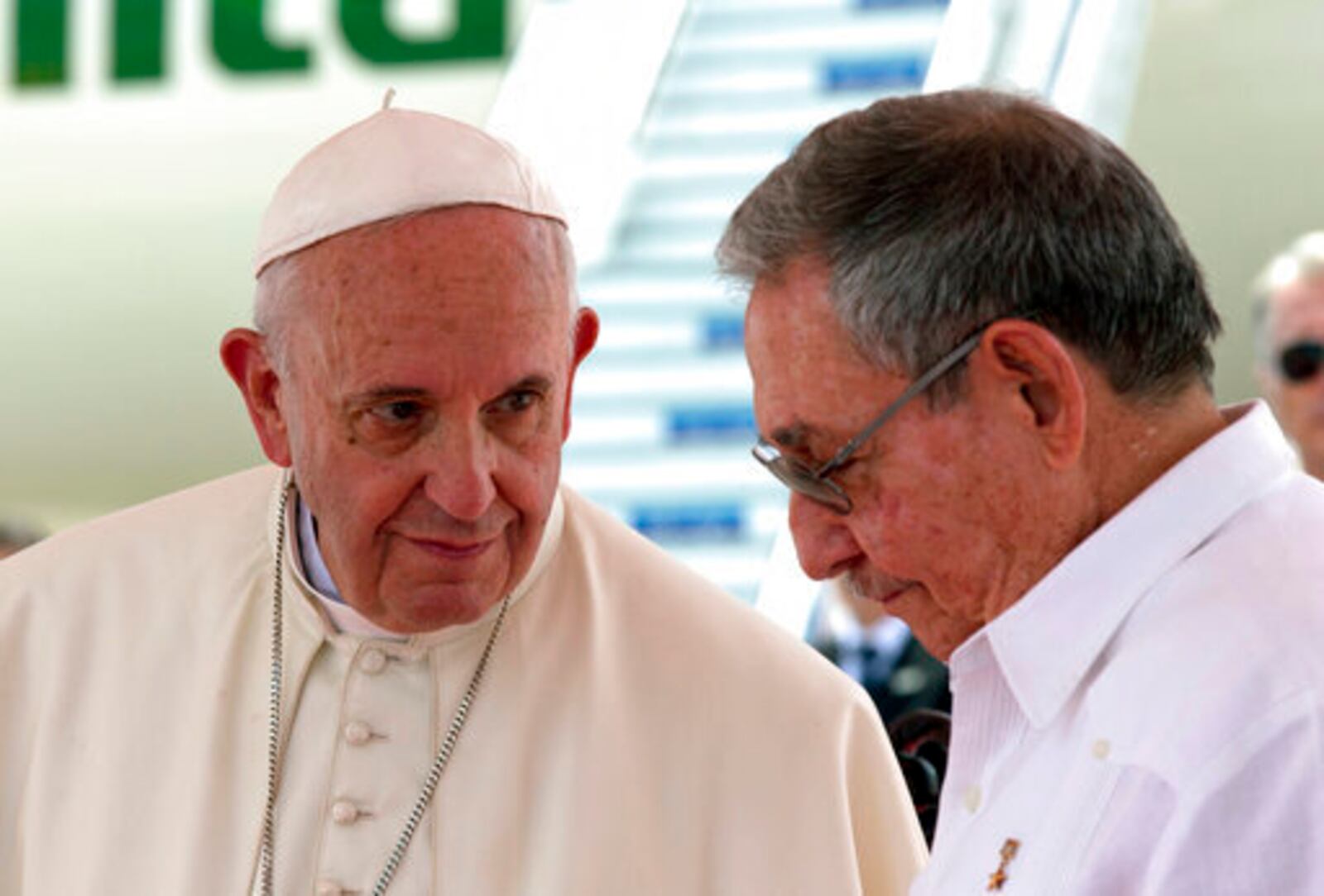 FILE - Pope Francis, left, looks at Cuba's President Raul Castro during his farewell ceremony at the airport in Santiago, Cuba, Tuesday, Sept. 22, 2015. (AP Photo/Enric Marti, file)