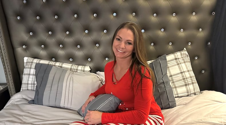 Alicia Erwin says the primary bedroom in her home is a favorite area, as it provides ample room for reading, writing and simply relaxing. She says the headboard is from Ashley Furniture and the bedding was purchased at Target. PHOTO/ROBIN MCMACKEN