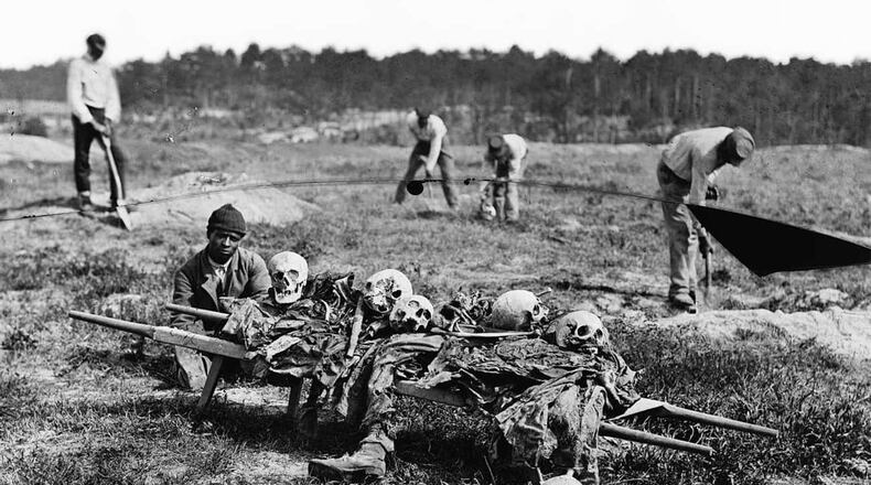African American Men Collecting Bones, Cold Harbor, VA, April 1865. (John Reekie, compiled by Hirst D. Milhollen and Donald H. Mugridge / Wikimedia Commons)
