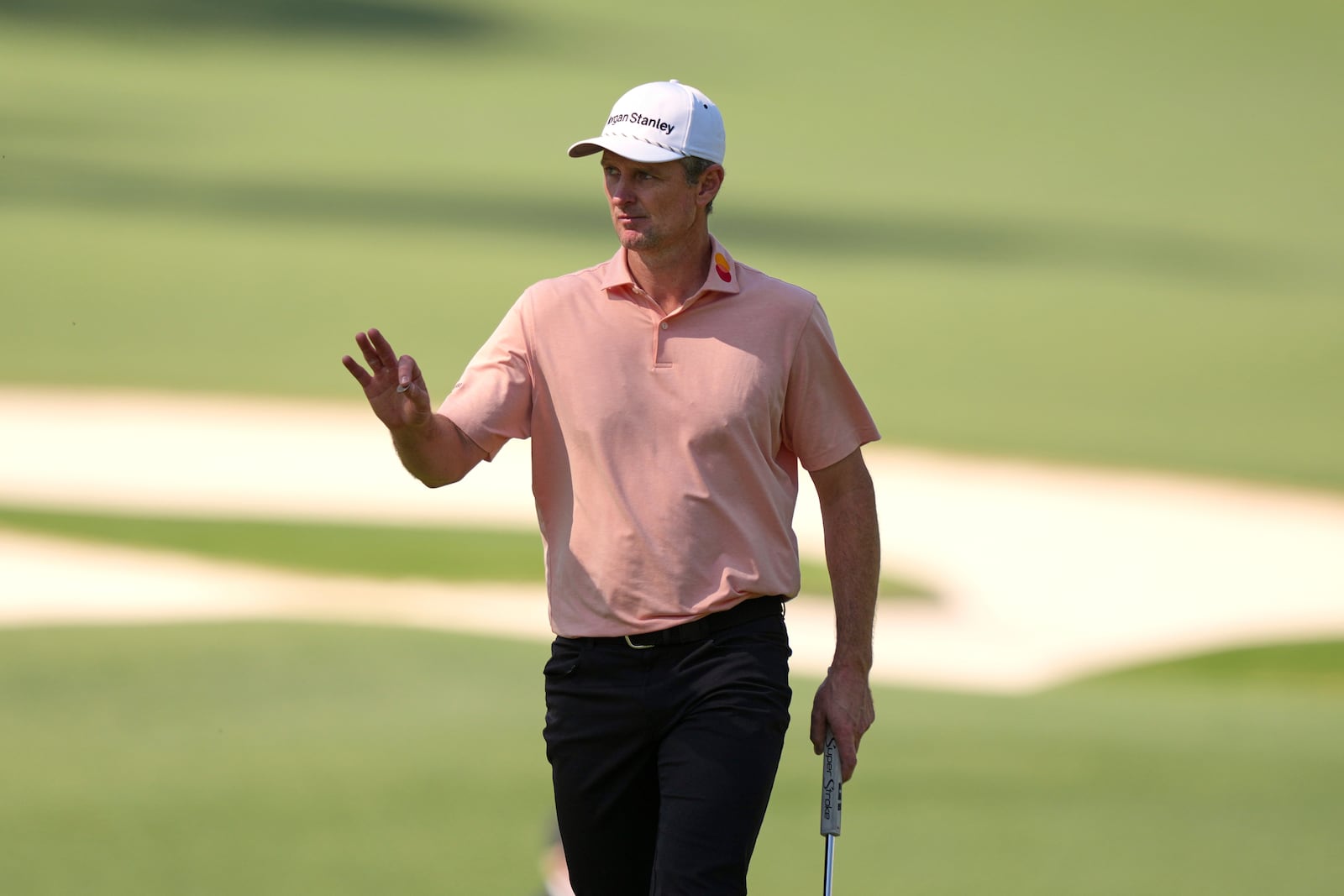 Justin Rose waves after making a putt on the 10th hole during the final round at the Masters golf tournament, Sunday, April 13, 2025, in Augusta, Ga. (AP Photo/Matt Slocum)