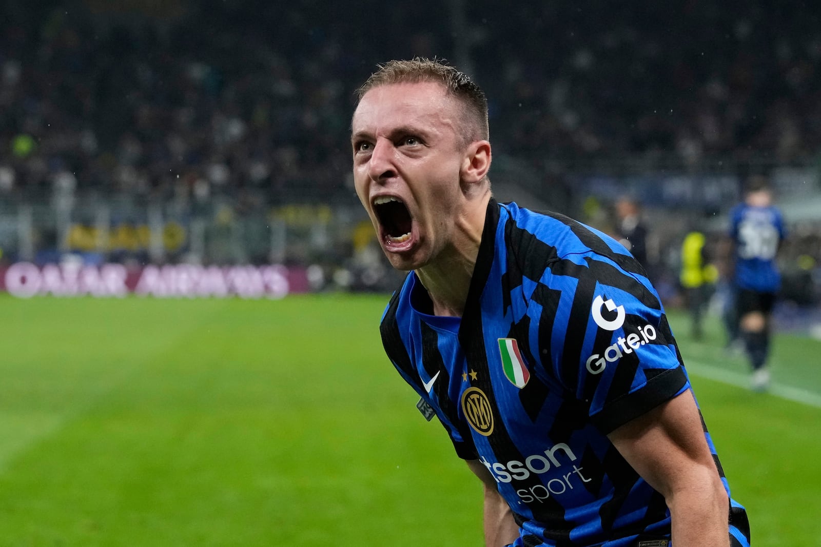 Inter Milan's Davide Frattesi celebrates after scoring his side's fourth goal during the Champions League semifinal second leg soccer match between Inter Milan and Barcelona at San Siro stadium in Milan , Italy, Tuesday, May 6, 2025. (AP Photo/Luca Bruno)
