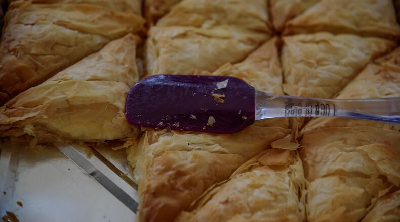 The 60th annual Greek Festival took place over the weekend from Friday, Sept 7 to Sunday, Sept 9 at The Annunciation Greek Orthodox Church, 500 Belmonte Park North in Dayton. This year's event had amazing food, devoted volunteers and the support and attendance of the community, despite it raining throughout the weekend. TOM GILLIAM / CONTRIBUTING PHOTOGRAPHER