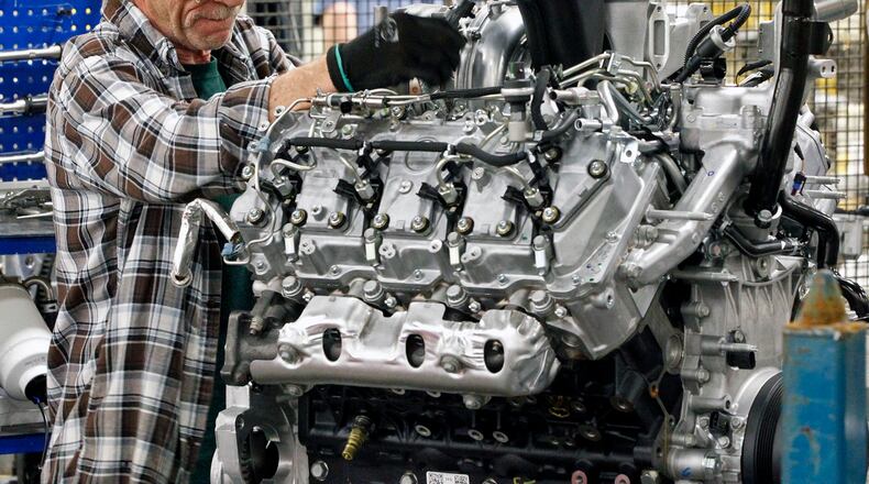 DMAX workers Gary Gillman works on a 6.6 liter Druamax Diesel at the company’s Moraine plant. TY GREENLEES / STAFF