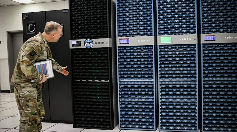 Brig Gen Jason Bartolomei, commander of Air Force Research Laboratory (AFRL), checks-out AFRL's new $70M supercomputer investment. JIM NOELKER/Staff