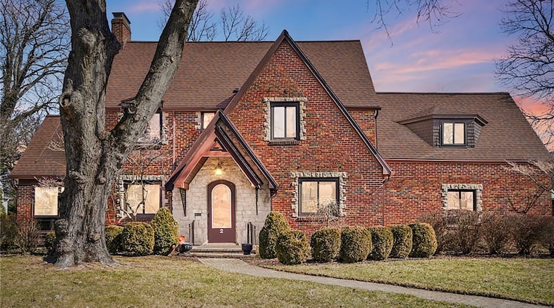 This brick two story maintains much of its historical charm but features new luxury updates.