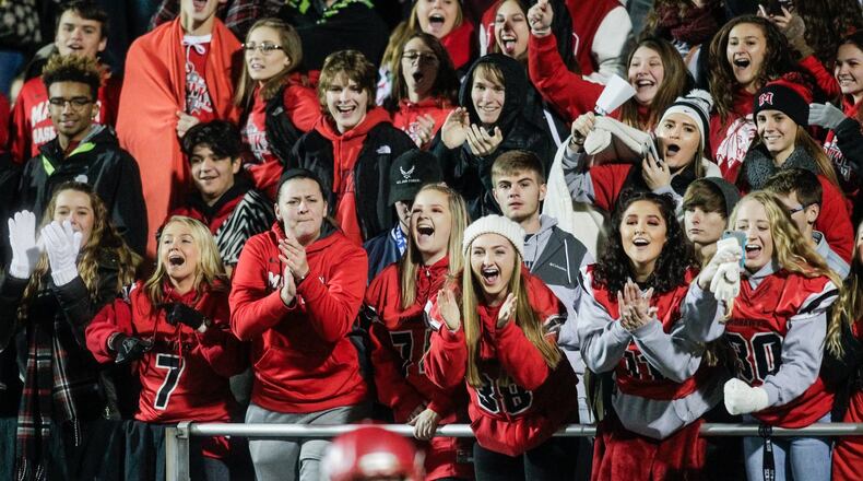 Madison fans cheer for their team during a 42-7 win over West Jefferson in the Division V, Region 20 final Nov. 17, 2017, at Beavercreek. NICK GRAHAM/STAFF