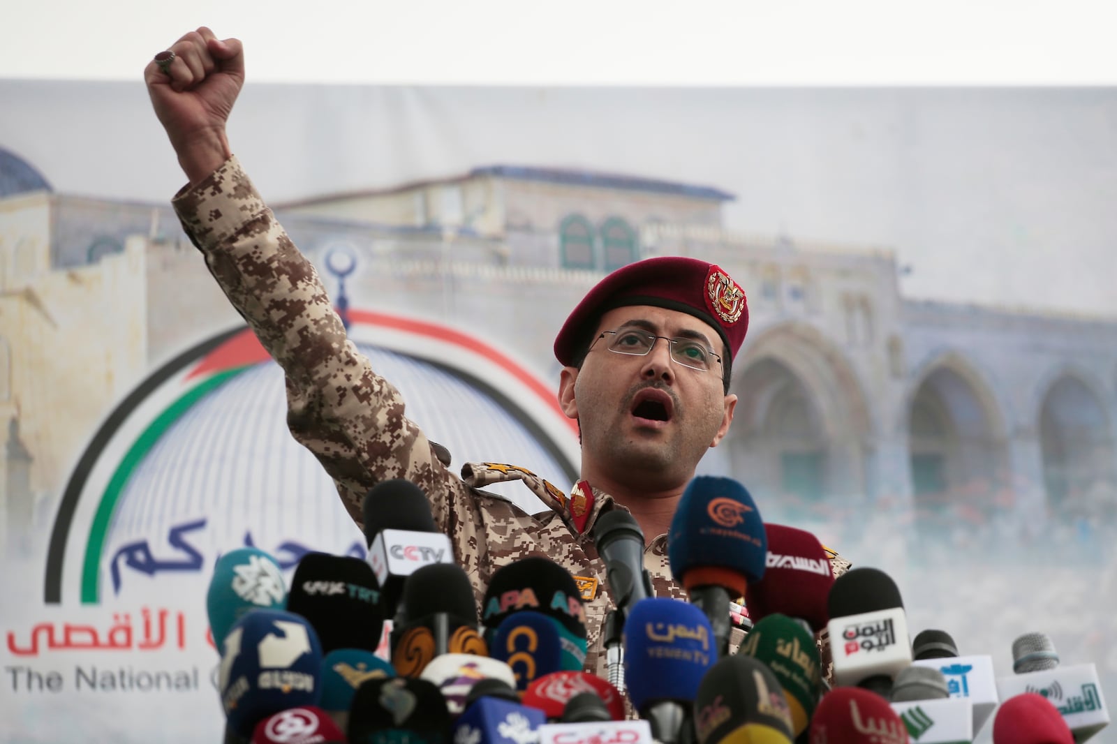 Houthi military spokesman Yahya Saree speaks at a rally against the U.S. and Israel in Sanaa, Yemen, Friday, April 18, 2025. (AP Photo/Osamah Abdulrahman)