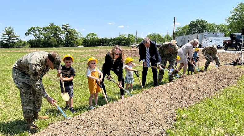 Military and civilian leaders broke ground Monday for construction of a child development center on Area A of Wright-Patterson Air Force Base. THOMAS GNAU/STAFF