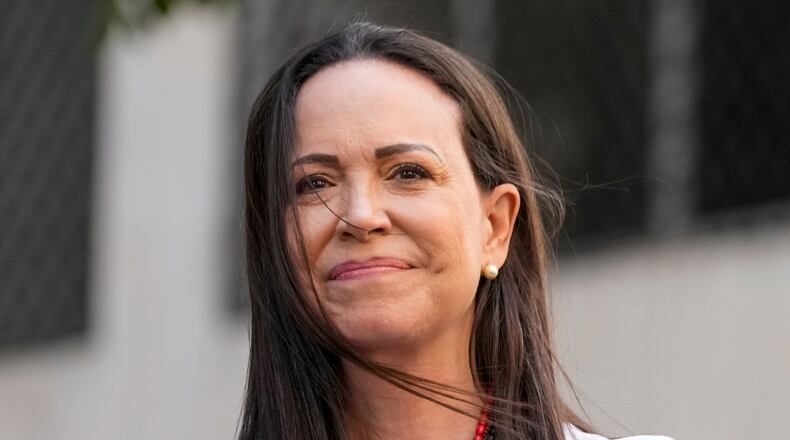 FILE - Opposition leader Maria Corina Machado gestures to supporters during a protest against President Nicolas Maduro the day before his inauguration for a third term, in Caracas, Venezuela, Thursday, Jan. 9, 2025. (AP Photo/Ariana Cubillos, file)