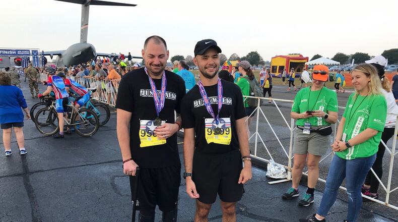 Retired Marine corporal Matthew Bradford (left) and guide Anthony Allen on Saturday at the U.S. Air Force Marathon. Tom Archdeacon/CONTRIBUTED