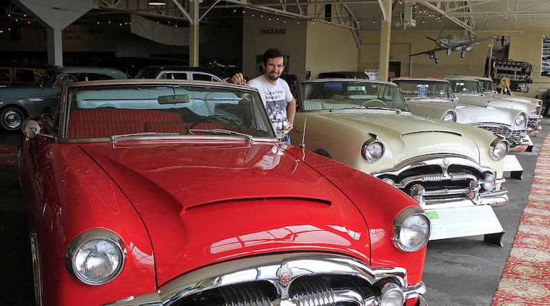 Dan Badger, managing director of America’s Packard Museum, stands next to a 1953 Packard Caribbean. This row of cars contains all of the final models of the Caribbean made by Packard. The car by Badger was once owned by star Perry Como. © 2019 Photograph by Skip Peterson