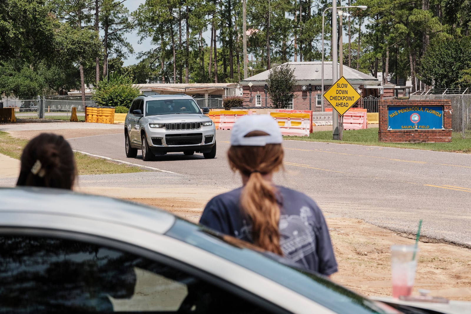 Kelsey Heath, left, and Emma Touchstone, 17, wait for reality television star Todd Chrisley to walk out of the Federal Prison Camp, Wednesday, May 28, 2025, in Pensacola, Fla. (AP Photo/Dan Anderson)