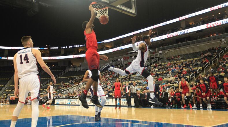 Xeyrius Williams dunks against Duquesne. David Jablonski/Staff