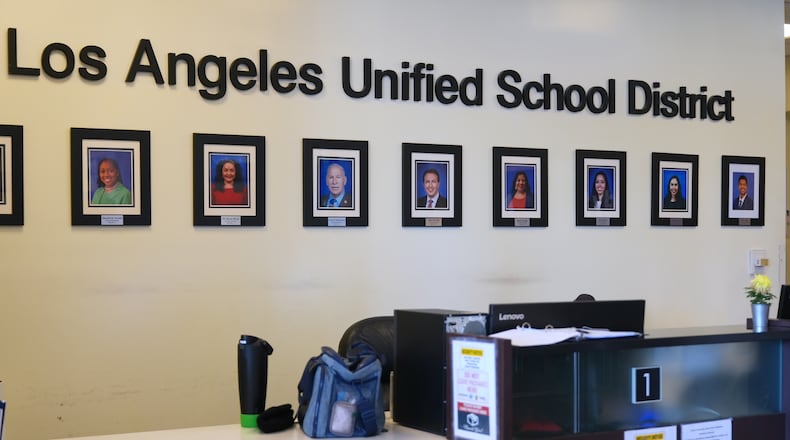 Photos of board members decorate the walls inside LAUSD headquarters Wednesday, Feb. 25, 2026, in Los Angeles. (AP Photo/Damian Dovarganes)
