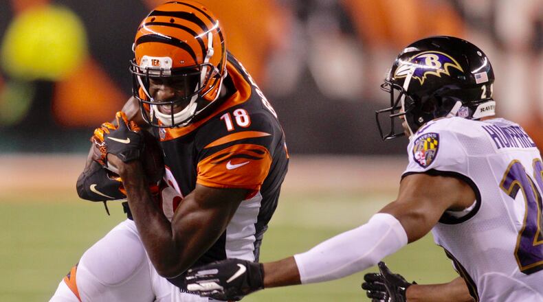 Cincinnati Bengals wide receiver AJ Green carries the ball after a catch during their 34-23 win over the Baltimore Ravens Thursday, Sept. 13 at Paul Brown Stadium in Cincinnati. NICK GRAHAM/STAFF