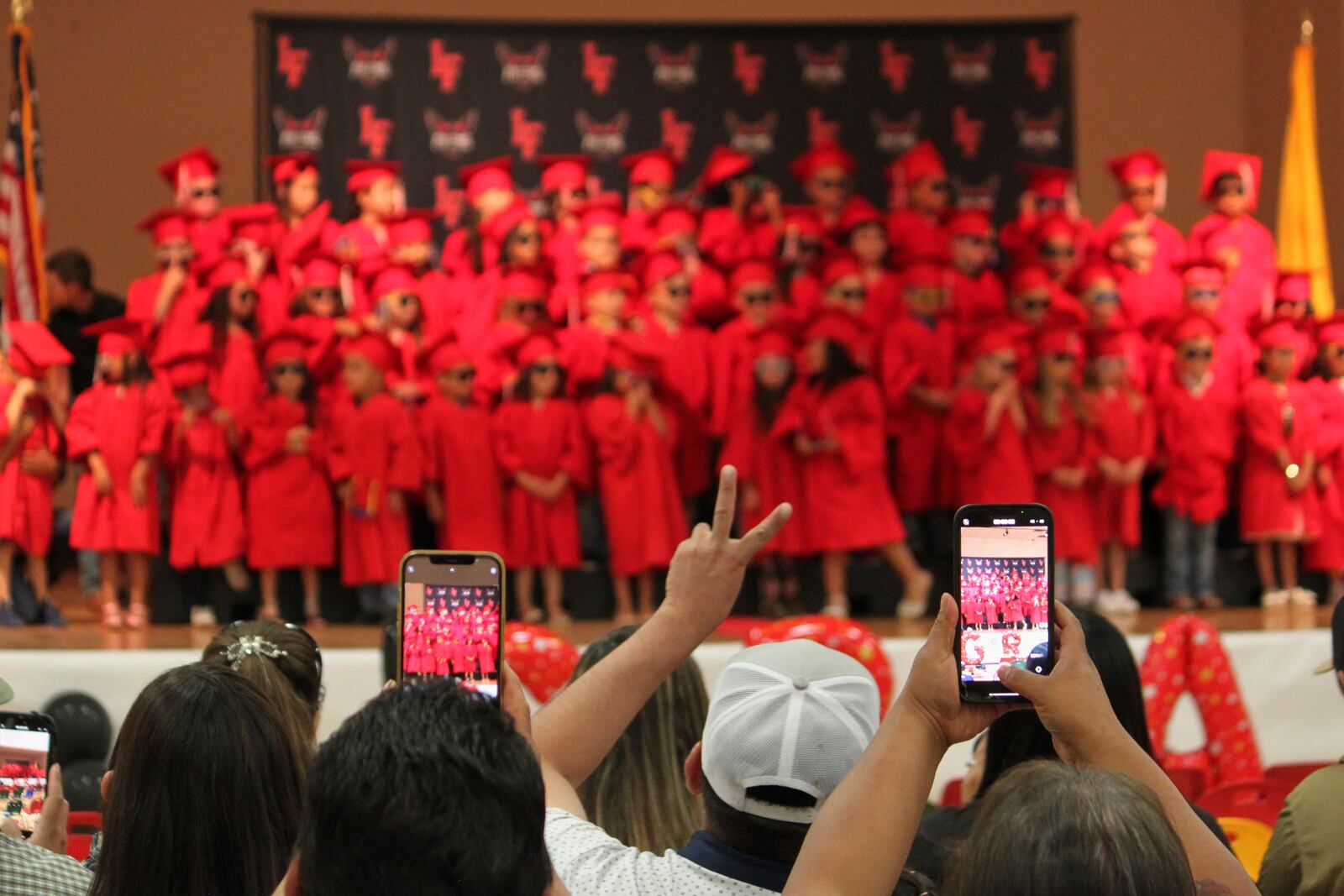 Family and friends take photos of kindergartners at Loving Elementary School graduation ceremony in Loving, N.M., on Tuesday, May 20, 2025. (AP Photo/Susan Montoya Bryan)