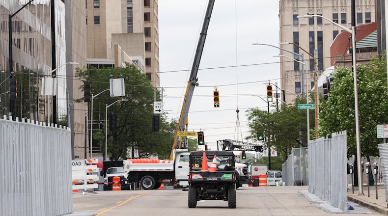 Tear down work continues in downtown Dayton on Tuesday, May 27, 2025 after the NATO Parliamentary Assembly concluded Monday. BRYANT BILLING / STAFF