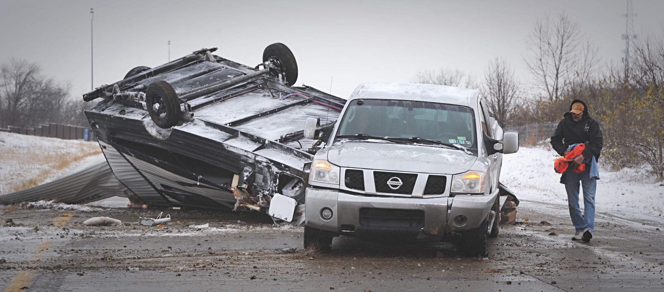 I-70 west ramp closes after trailer rolls over due to slick roads
