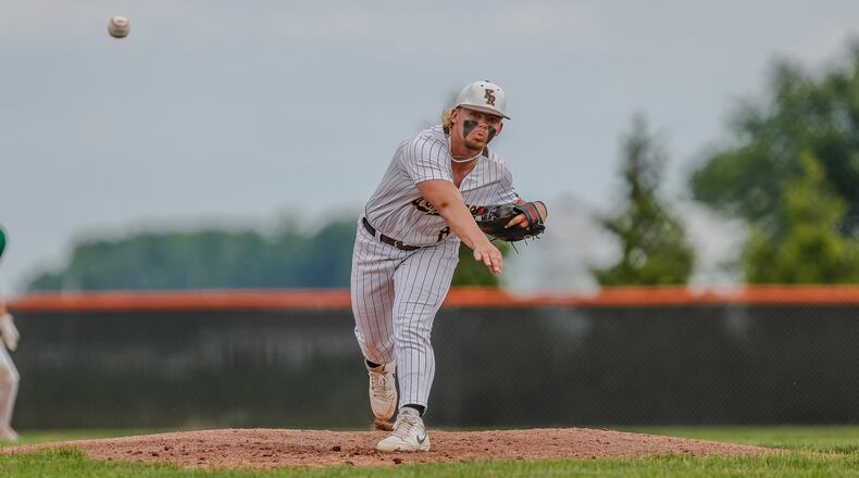 Cutline: Kenton Ridge High School junior Jake Beard delivers a pitch during their Division II district final game against Chaminade Julienne on Thursday night at Arcanum High School. Beard threw a one-hitter as the Cougars won 3-0. Michael Cooper/CONTRIBUTED