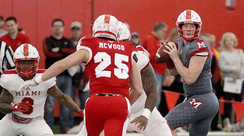 Miami quarterback Gus Ragland looks for a receiver during Saturday’s “Spring Showcase” at the Dauch Indoor Sports Center in Oxford. E.L. HUBBARD / CONTRIBUTED